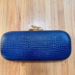 Diane Von Firstenburg, hard blue clutch with gold hardware